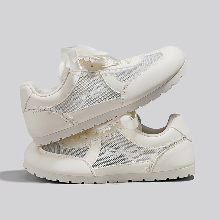 Dame Sneakers i romantisk design med dekorative sløjfer og åndbart mesh-overflade Stilla