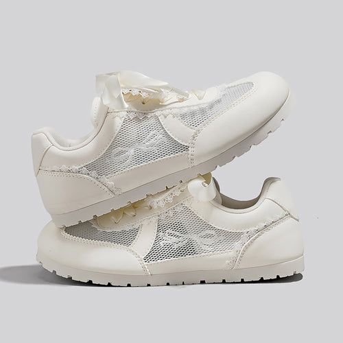 Dame Sneakers i romantisk design med dekorative sløjfer og åndbart mesh-overflade Stilla