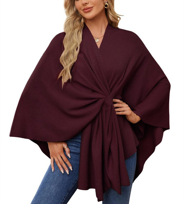 Dame elegant strikkeponcho med raffinerede draperinger og taljebælte Stilla