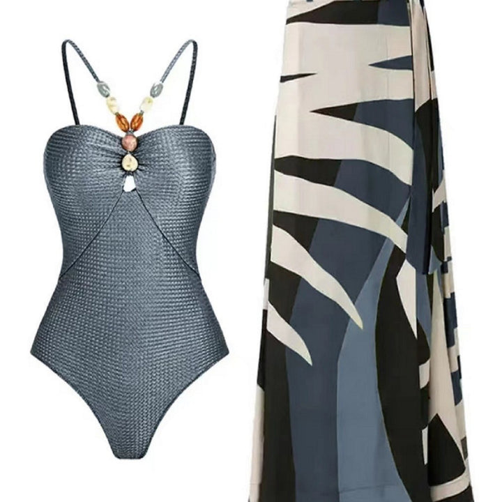 Dame badetøj med trendy cut-out og elegant indpakningsskørt Skovae