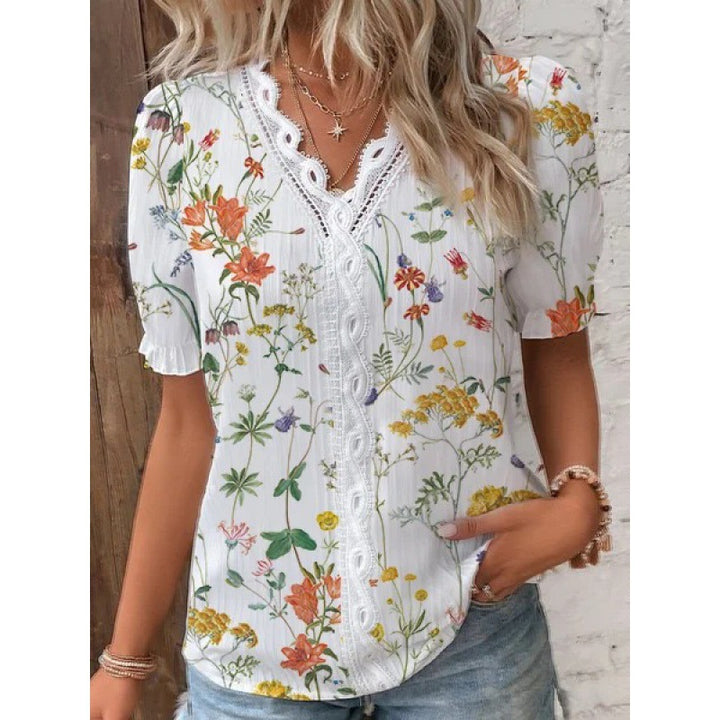 Damebluse med blomsterbroderi og knaplæst Stilla