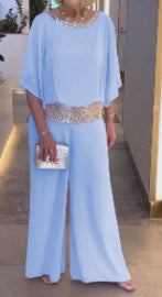 Dame elegant jumpsuit med flydende overdel og glitrende taljebånd Stiila
