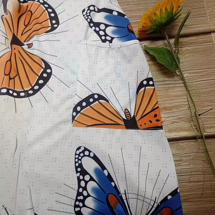 Dame jumpsuit med farverigt sommerfuglemønster og praktiske lommer Stilla