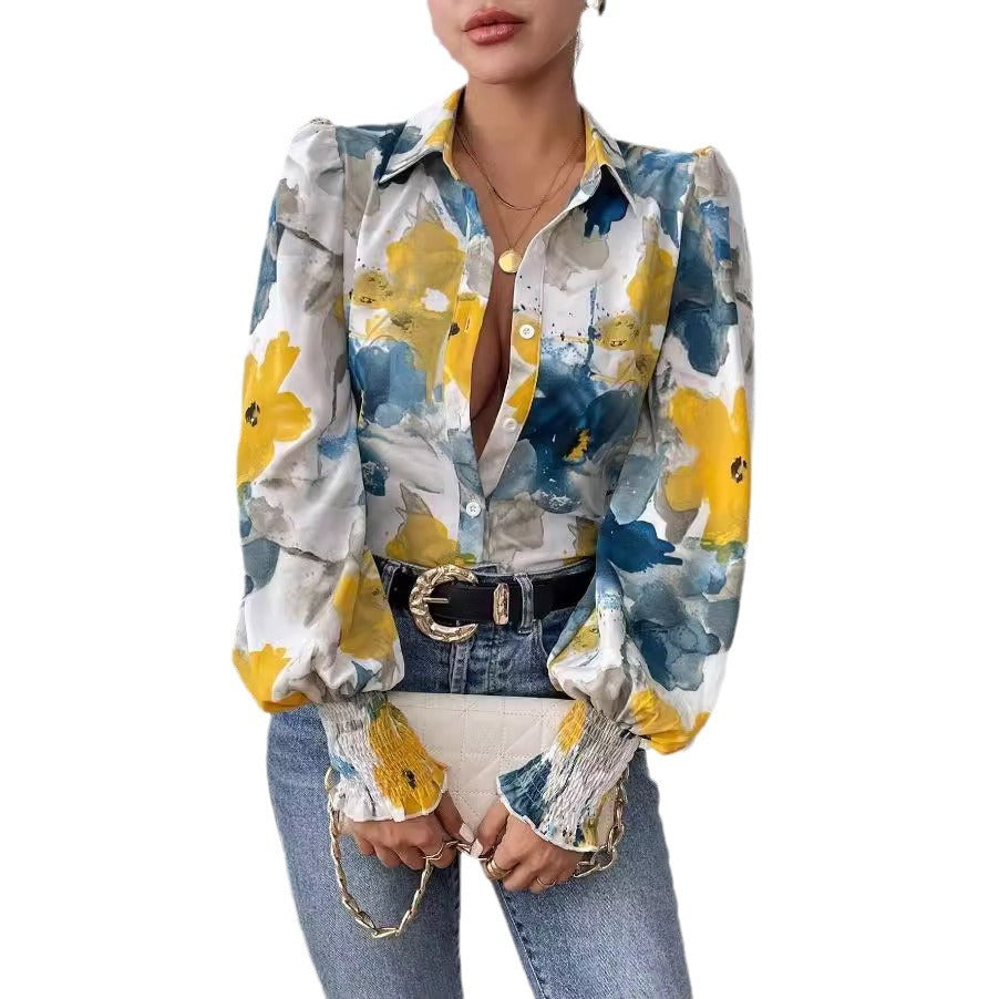 Dame elegant bluse med farverigt floralt design og afslappede puffærmer Stilla