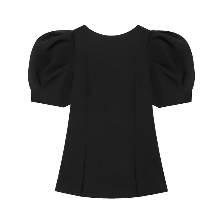 Damebluse med puffærmer og elegant snit Skovae