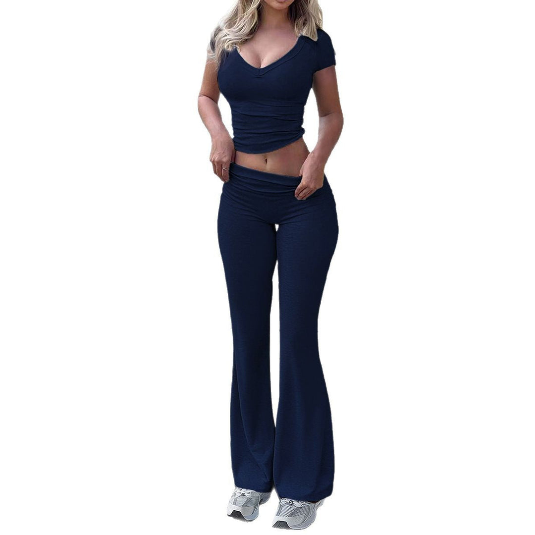 Dame sport-lounge-sæt med figurformende top og elegante flared-bukser Skovae