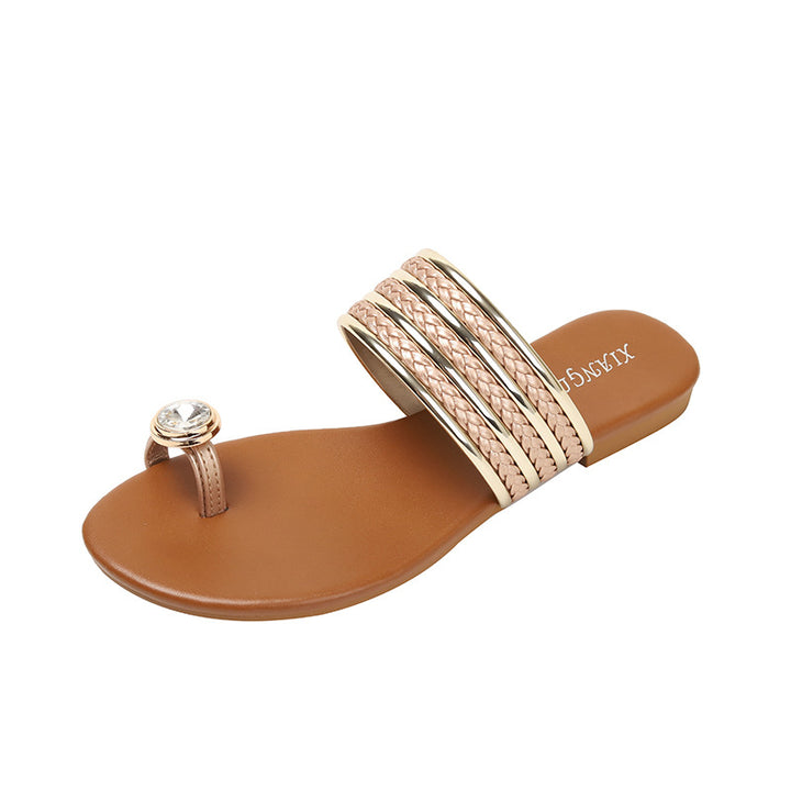 Dame flip-flops med flettede remme og funklende accent Stilla