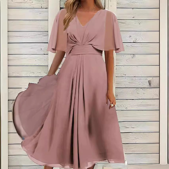 Dame Midikjole med svajende skørt og elegante flæseærmer Stilla