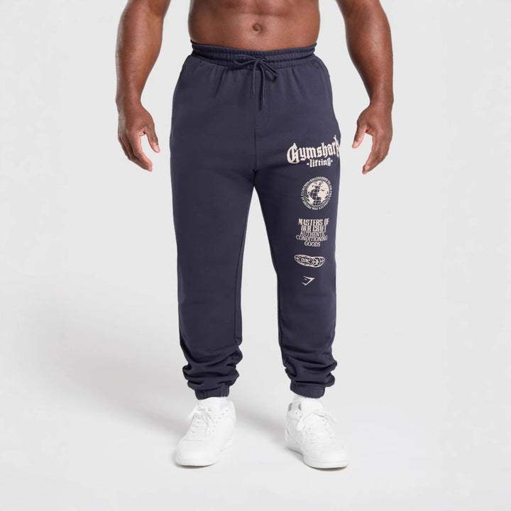 Herre nan konisk skåret bomuldsfleece-sweatpants med elastisk snoretræk ribbede benafslutninger og stort logotryk Skovae