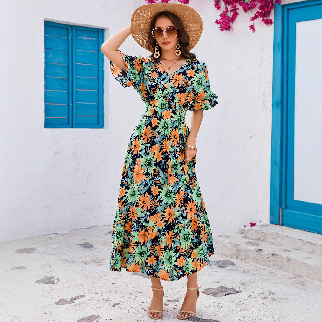 Dame maxikjole med blomstret design og svingende kant Stilla