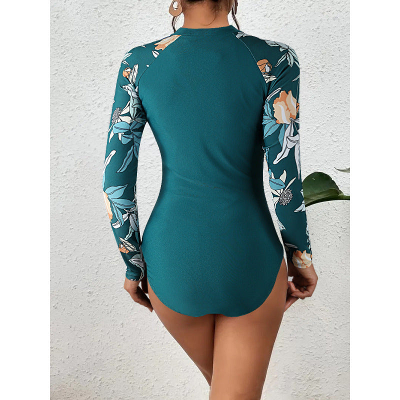 Dame surfdragt med blomsterdesign og sporty lynlås Skovae
