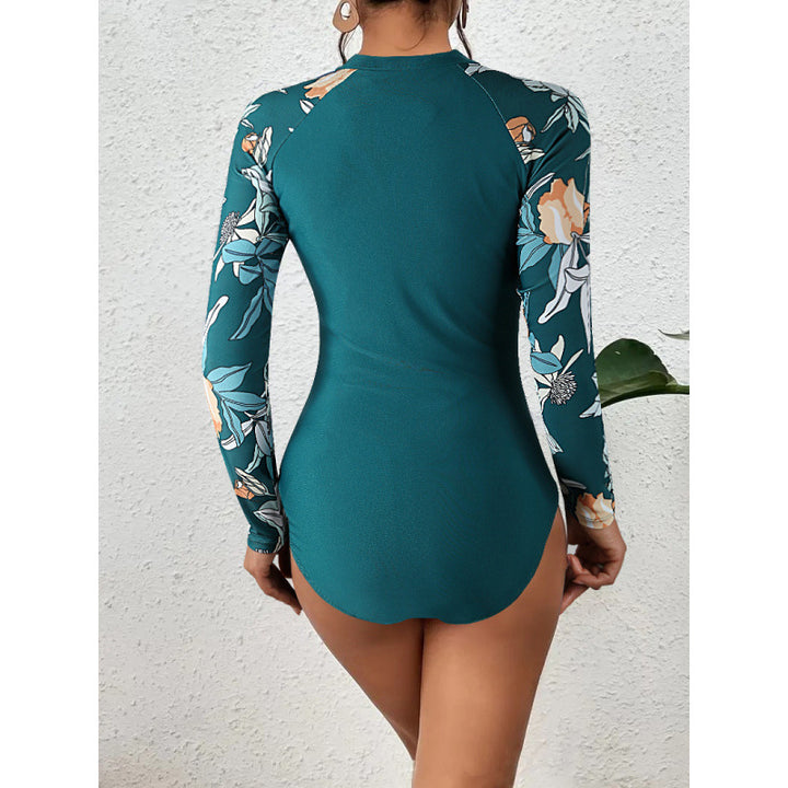 Dame surfdragt med blomsterdesign og sporty lynlås Skovae