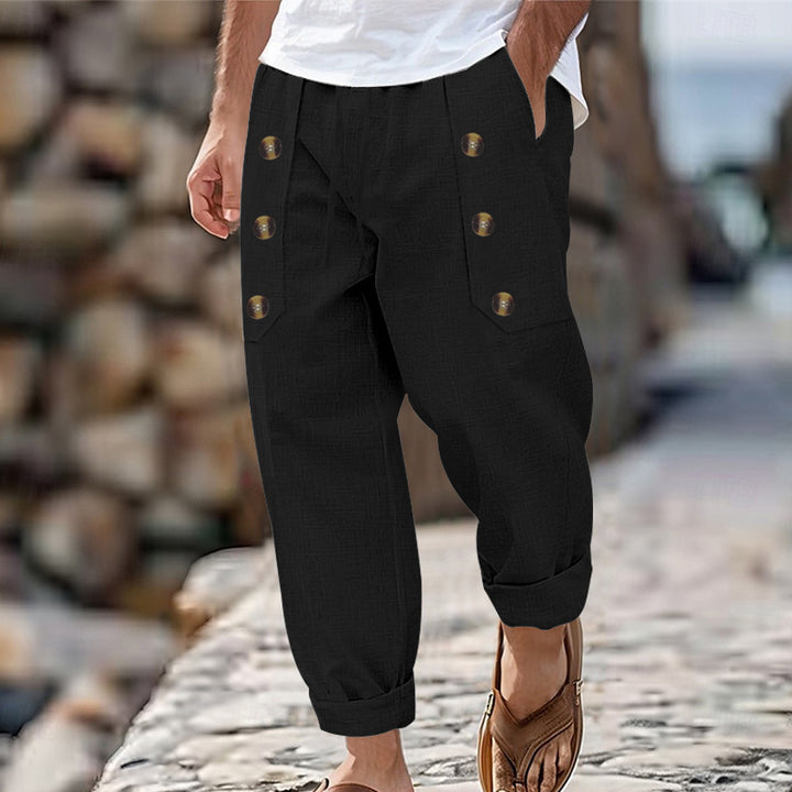 Herren nan loose linen pants with decorative button stripes, rolled ankle hem and side pockets Skovae