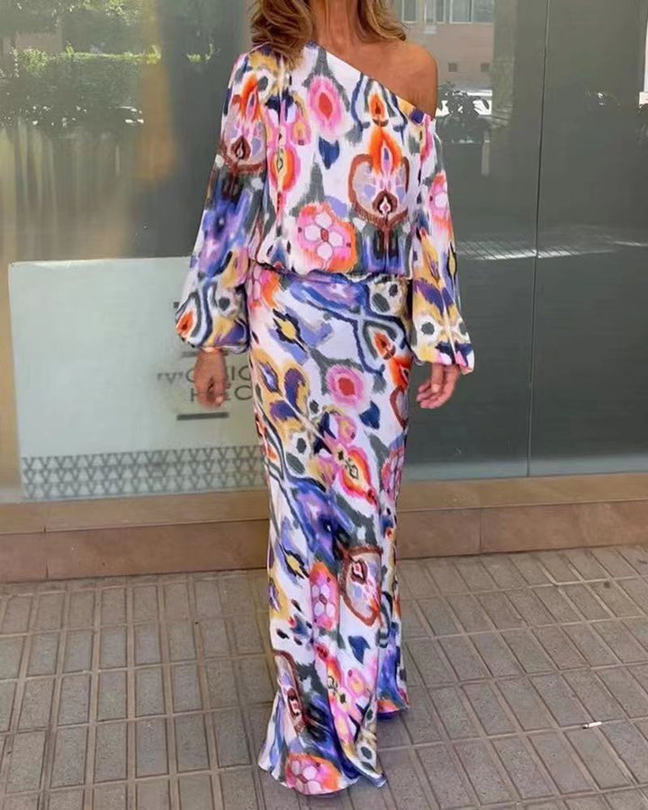 Damernes elegante maxikjole i asymmetrisk snit med glatte ærmer Stilla