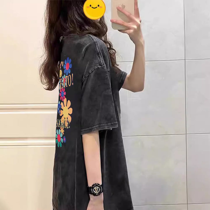 Dame T-shirt med kreativt blomster- og smiley-design Stilla