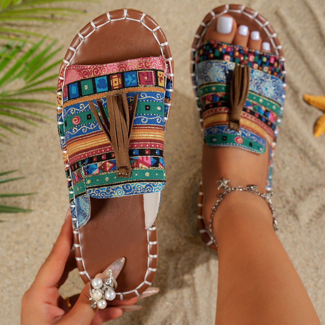 Dame slide-sandaler med farverigt vævdesign og fashionable kvaster Stilla