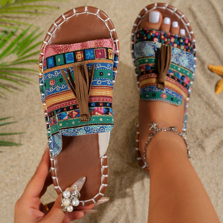 Dame slide-sandaler med farverigt vævdesign og fashionable kvaster Stilla