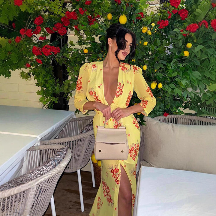 Dame maxikjole med florale applikationer og elegant split Stilla