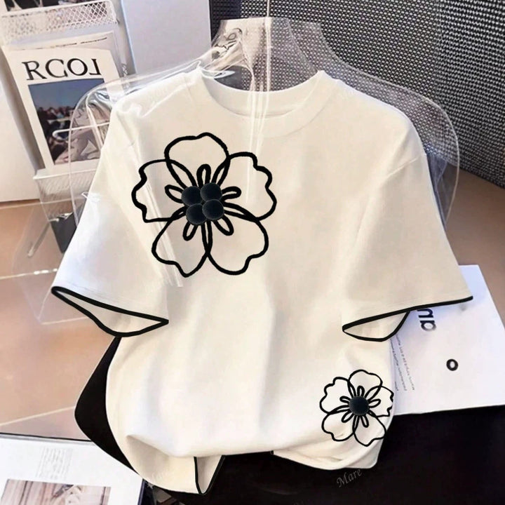 Dame T-shirt med blomstret design og løs pasform Skovae