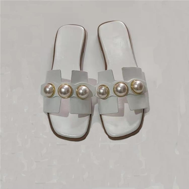 Dame pantoletten med elegant perle-design og moderne rem Stilla