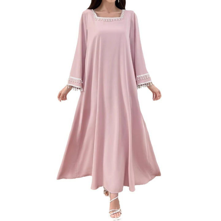 Kvinders elegante maxi kjole med dekorative frynser og brede ærmer Skovae