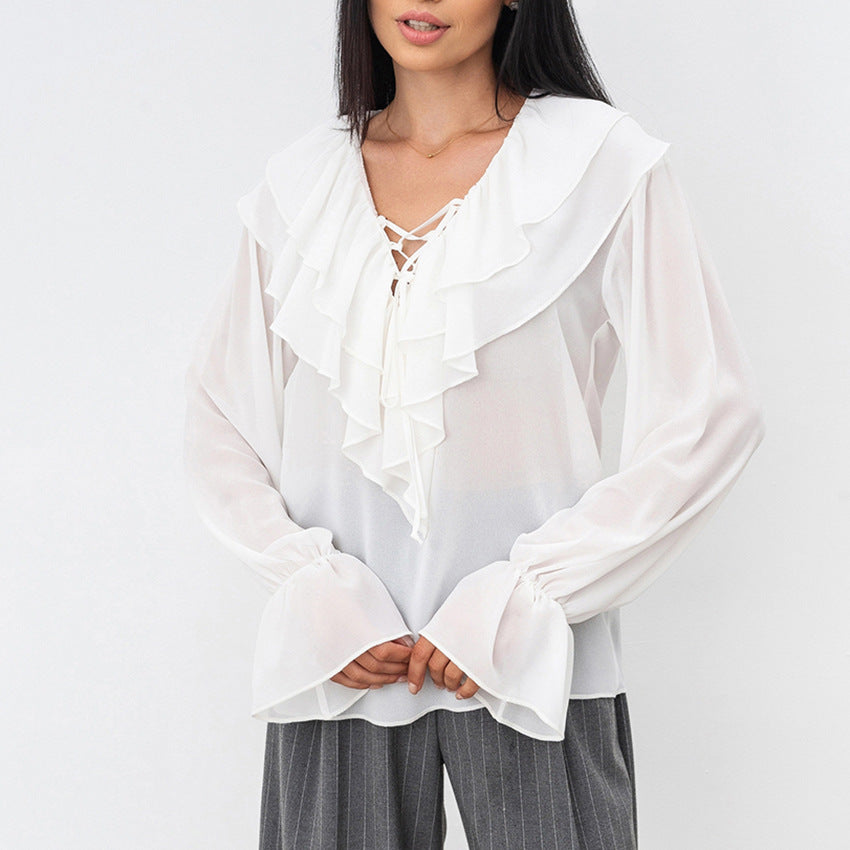 Damebluse med volantdesign og glitrende ærmer Stilla