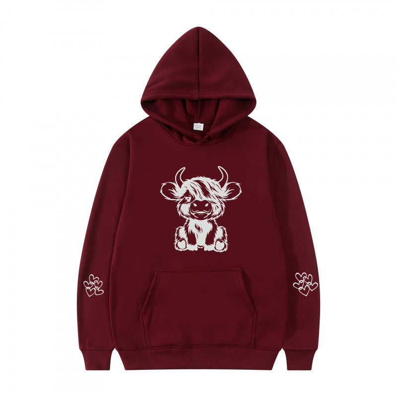 Kvindernes hætte sweatshirt med charmerende kvægmotiv og praktiske kængurulommer Skovae