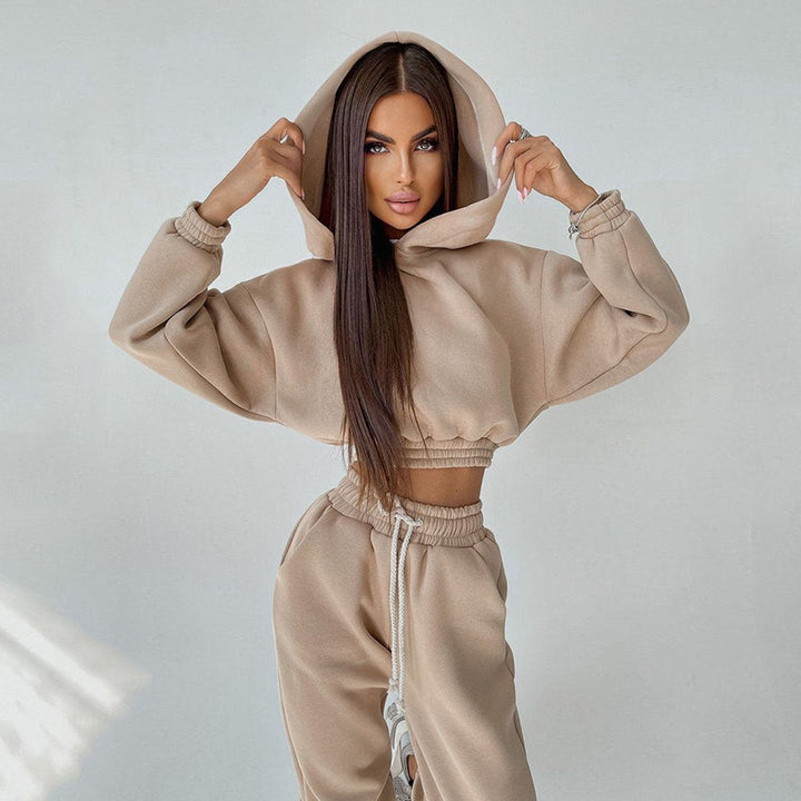 Kvinders sporty cropped sweat sæt med elastisk talje og praktiske lommer