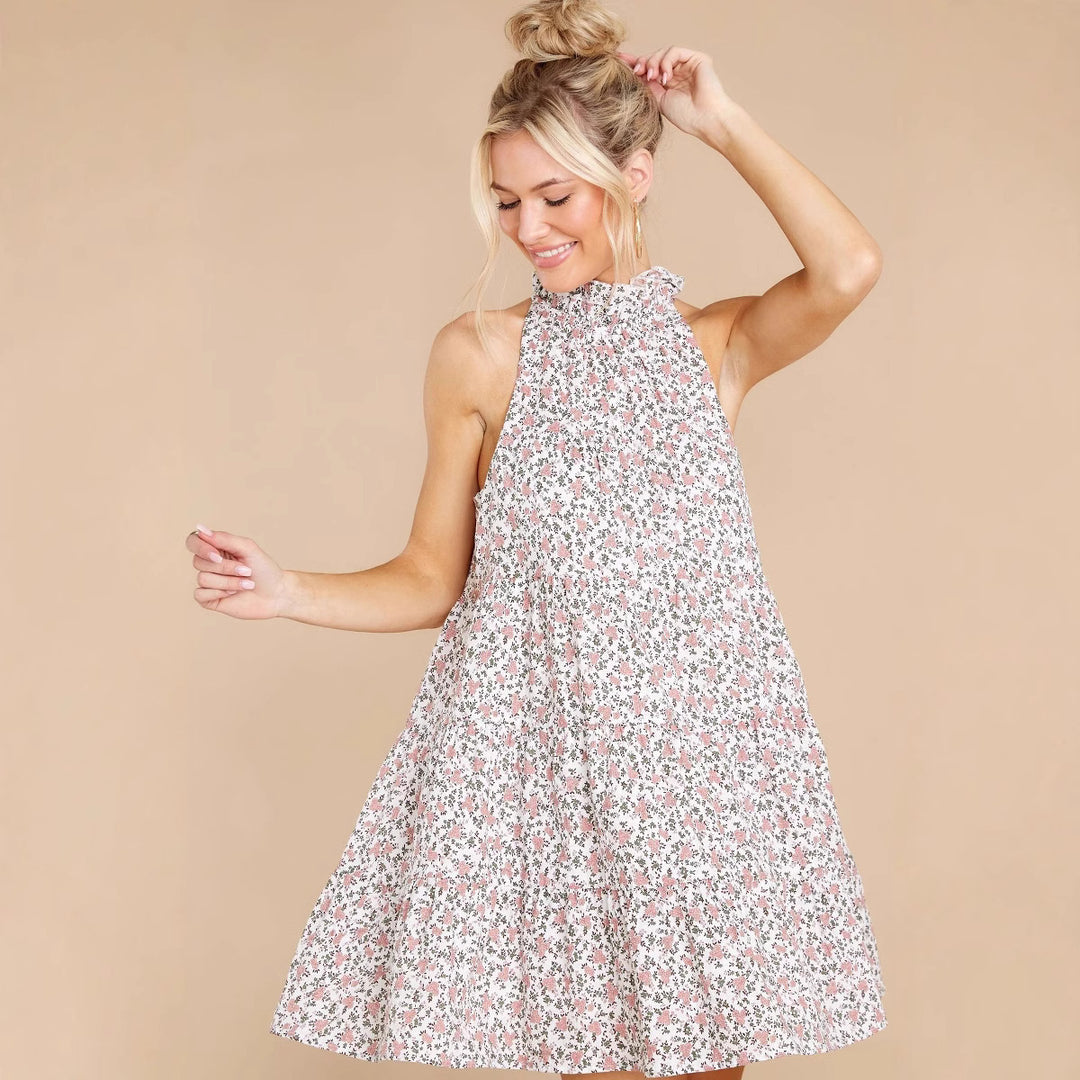 Women's halter dress with playful floral design and ruffle details