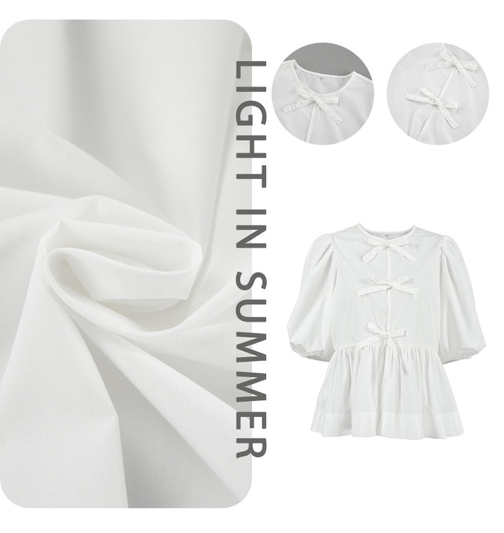 Damebluse med voluminøse pufærmer og stilfuld snor Stilla