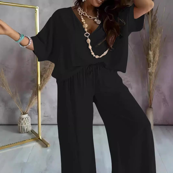 Dame jumpsuit med vidde snit og elegant V-udskæring Stilla