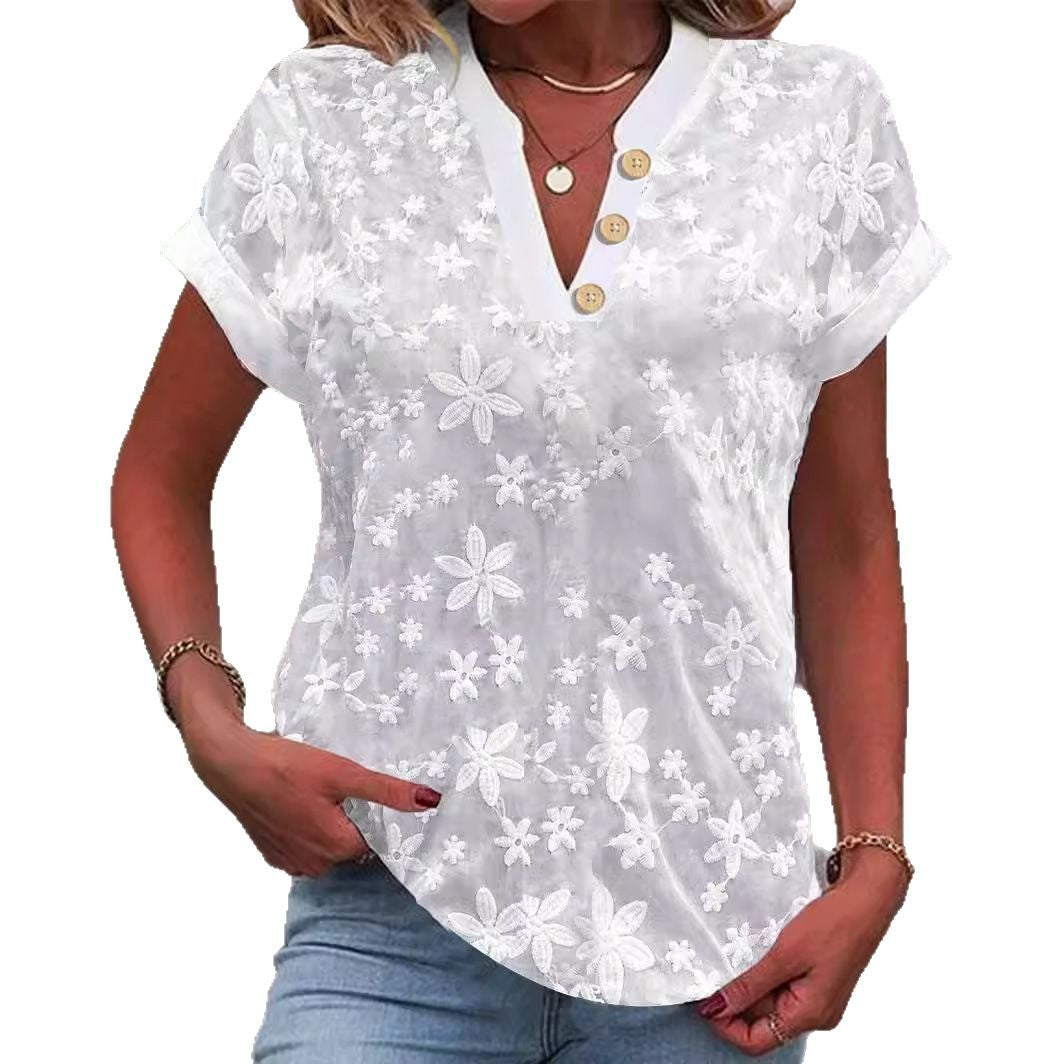 Damebluse med feminint blomsterbroderi-mønster Stilla