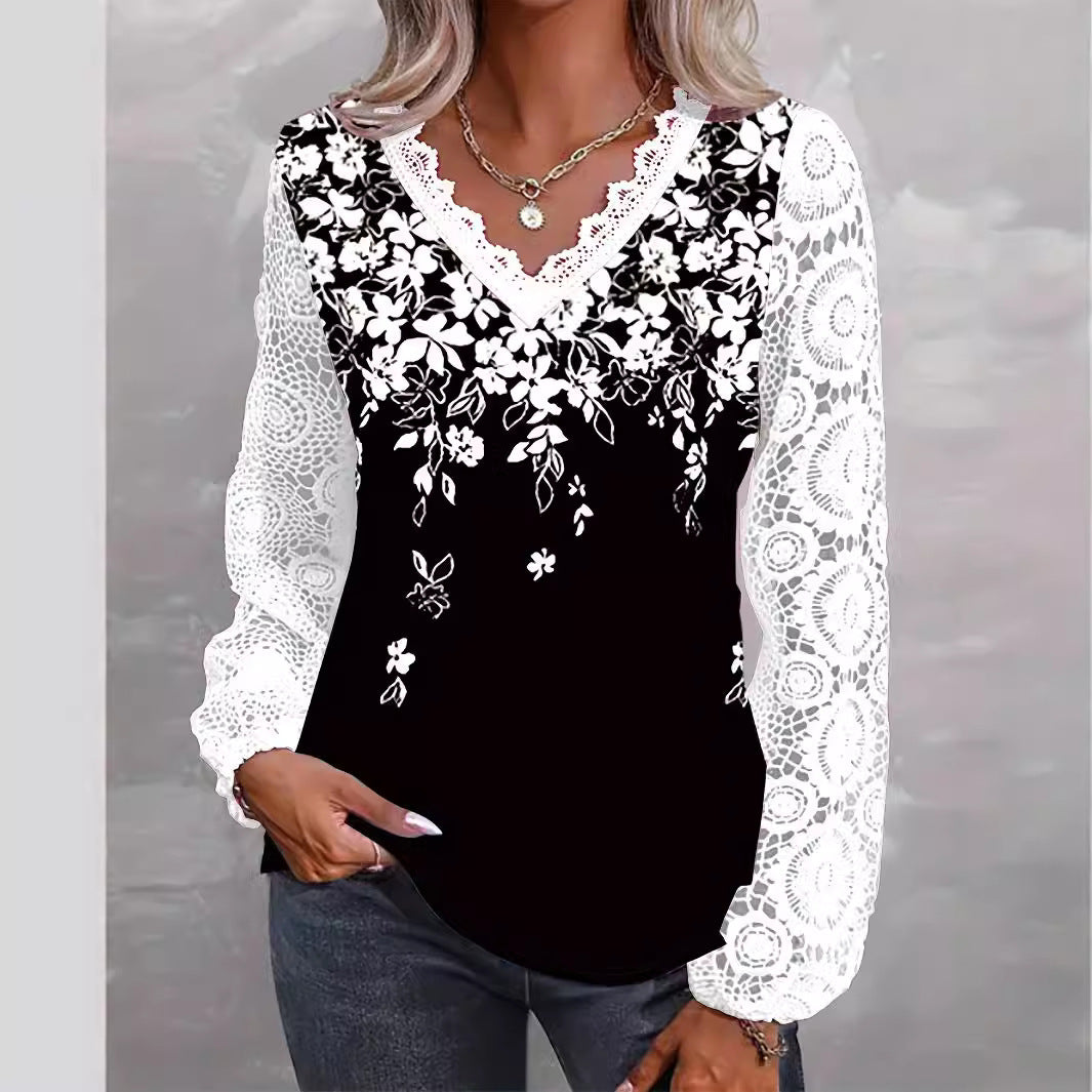 Damebluse med blomsteraccent og romantisk spidsærme Stilla