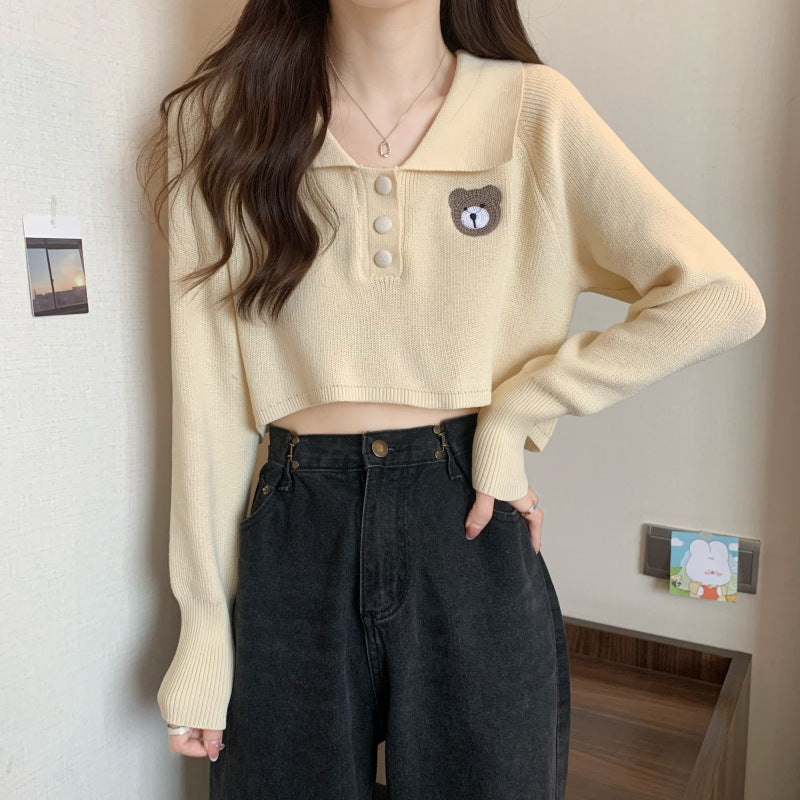 Kvinder Cropped Pullover med en knaplukning og unicorn emblem