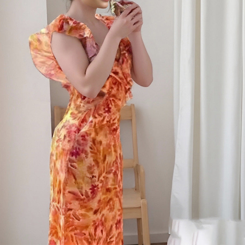 Dame maxikjole med voluminøse flæsedetaljer og elegant V-udskæring Stilla