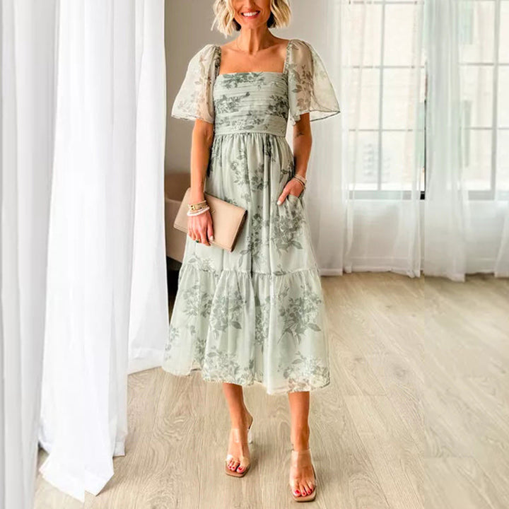 Dame Elegant blomsterkjole med gennemsigtige ærmer og taljering Stilla