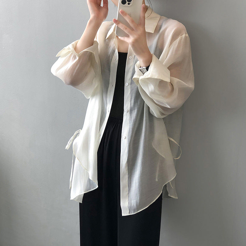 Dame løs bluse lavet af silkeblød materiale med elegante knapdetaljer og justerbare ærmer Stilla