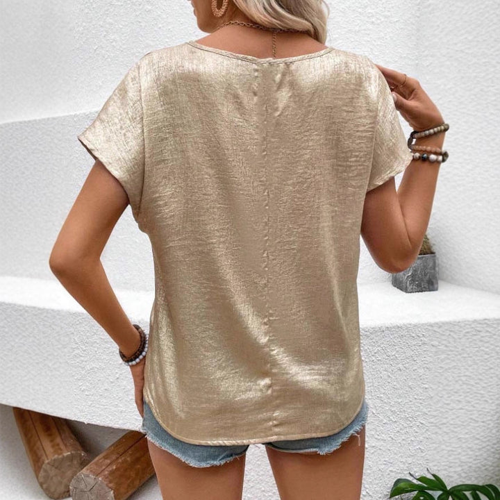 Dame Skinnende T-shirt med løst snit og omslagsærmedesign Stilla