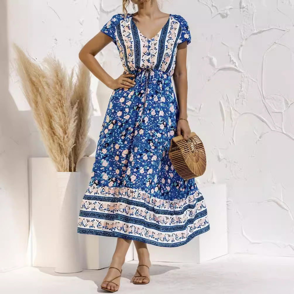Dame maxikjole med florale mønstre og elegant taljebind Stilla
