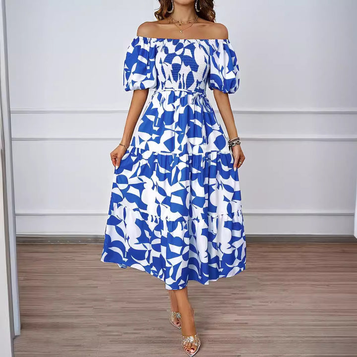 Dame sommerkjole med elegant puffærme-design og floralt mønster Stilla