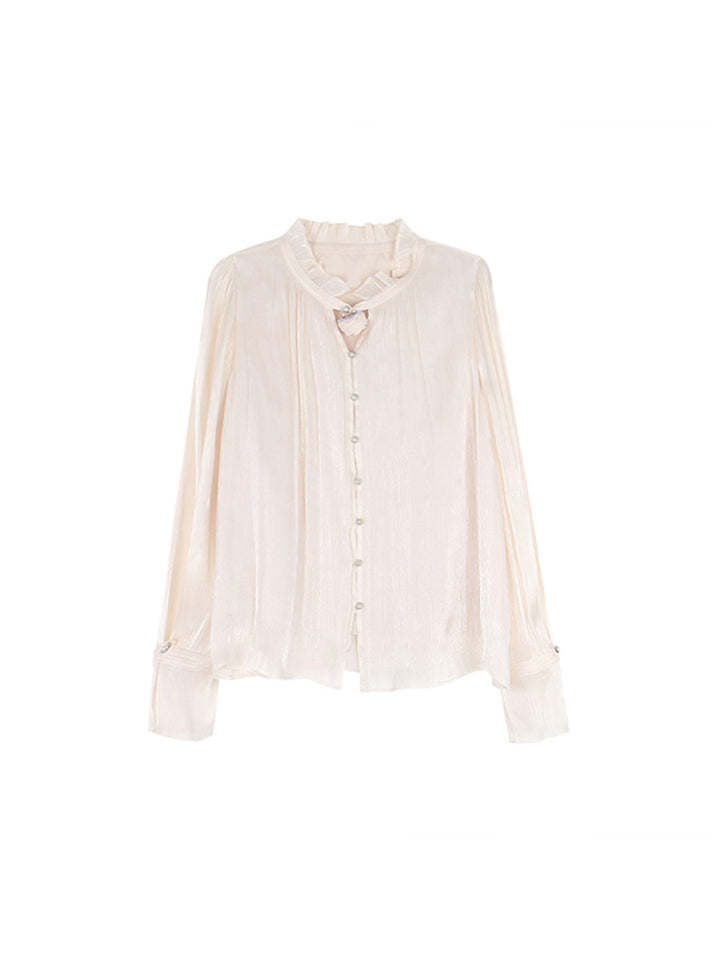 Dame chiffonbluse med elegante ruffles detaljer og knaplukning Stilla
