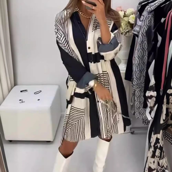 Dame knælangt A-linje skjortekjole med grafisk linjetræksprint, skjult knaplukning og oversized manchetter Skovae
