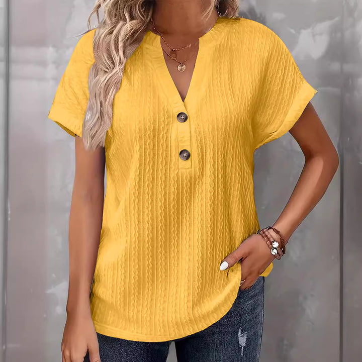 Damebluse med knapdetaljer og struktureret design Stilla