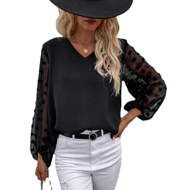 Damebluse med elegante pufærmer og struktureret overmateriale Skovae
