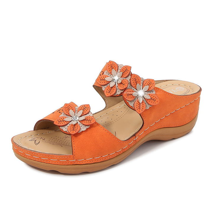 Dame pantoletten med florale accenter og ergonomisk design Stilla