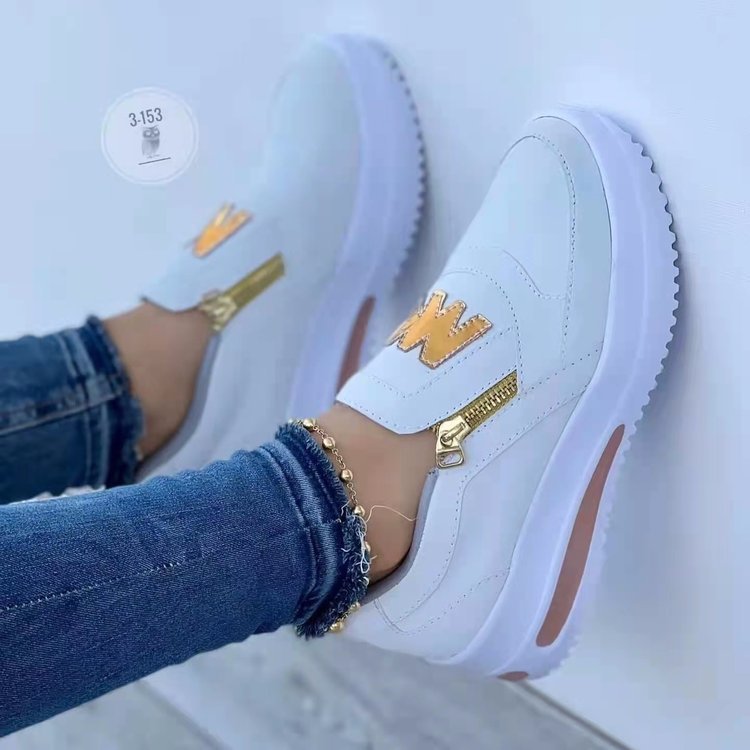 Dame mode Slip-On Sneakers med blank lynlås og logo-detail Stilla