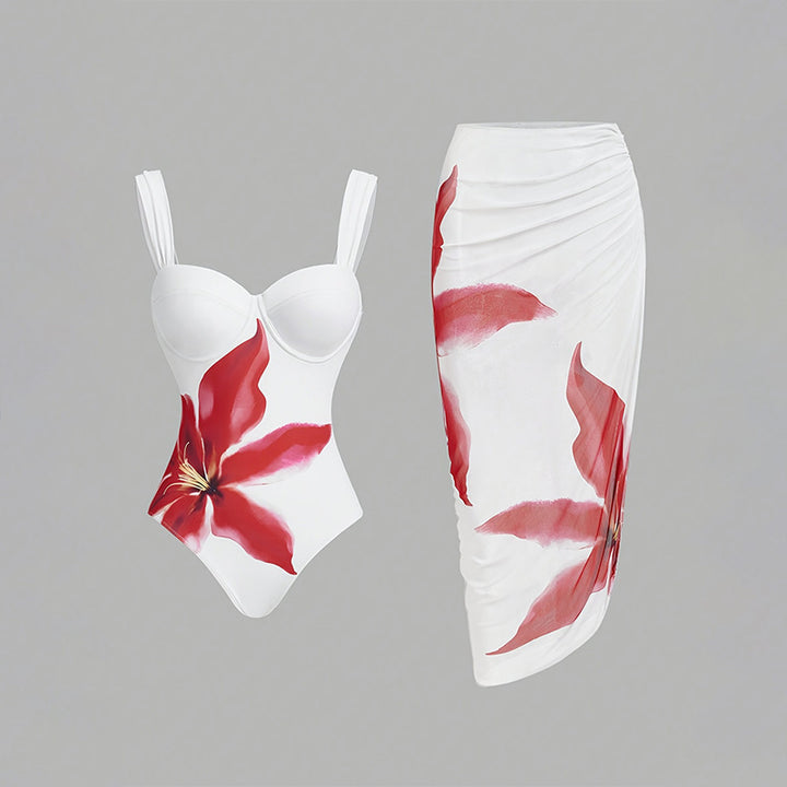 Dame one-piece badedragt med elegant blomsterapplikation og draperet skørt Skovae
