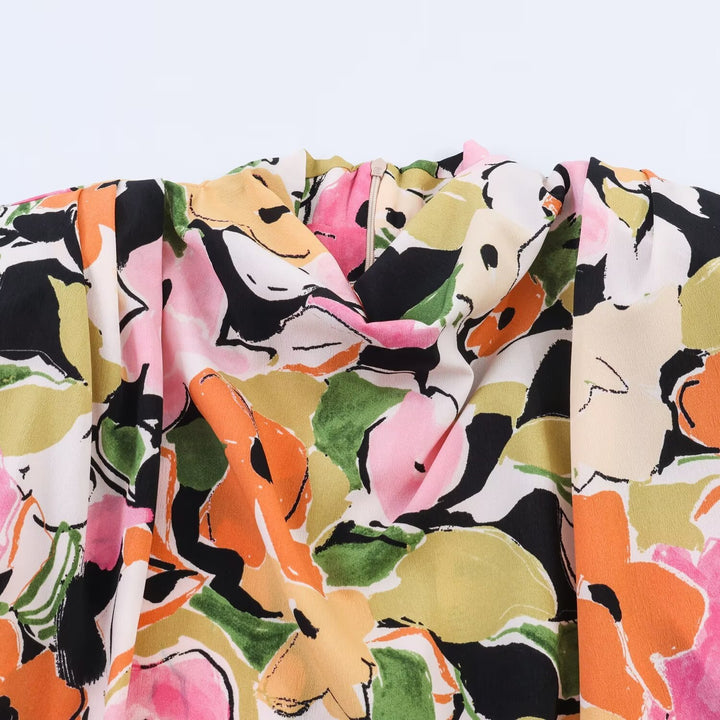 Damebluse med blomstermotiv og elegant knytning Skovae