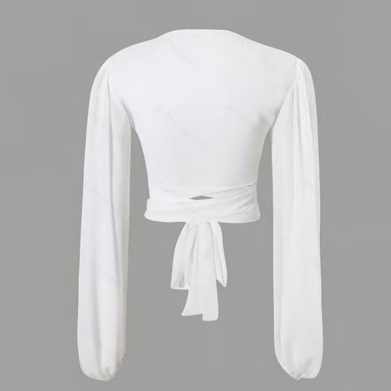 Dame indpakningsbluse med lange ærmer og elegant V-hals Skovae