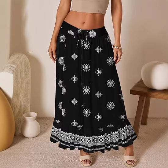 Dame jumpsuit med blomstertryk og elastisk talje